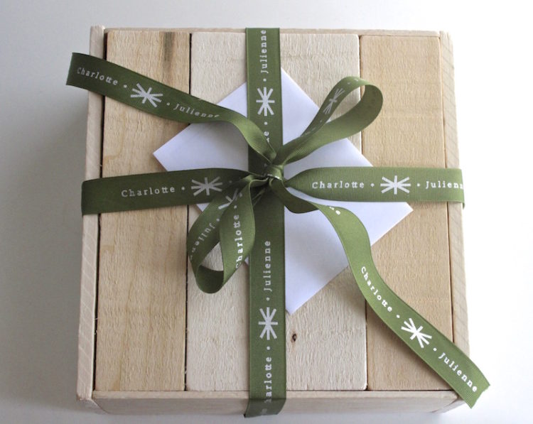 Wooden Gift Crate from Charlotte Julienne with green ribbon and a gift card