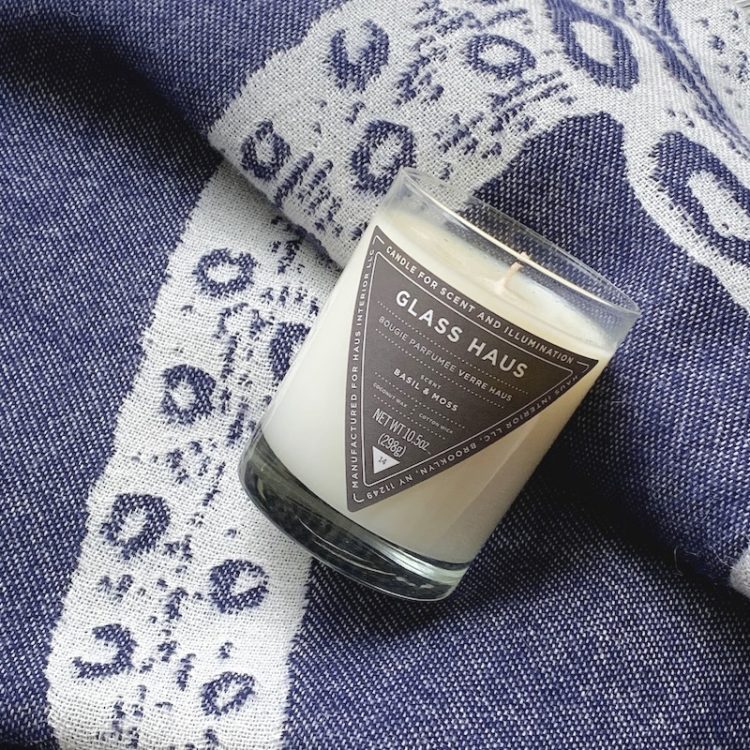 Navy Blue Alpaca Throw with Octopus Print by Thomas Paul and Glass Haus Coconut Wax Candle from Haus Interior
